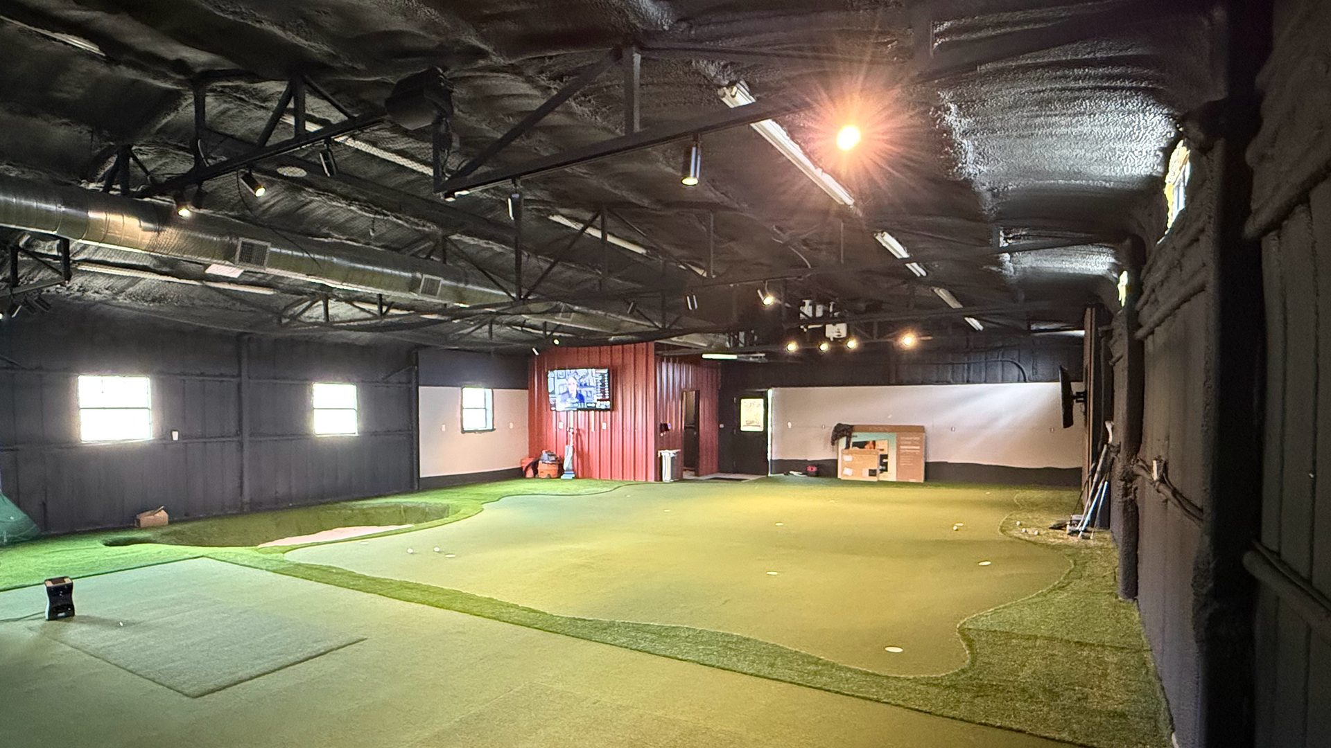 After: the finished indoor golf facility inside the former barn